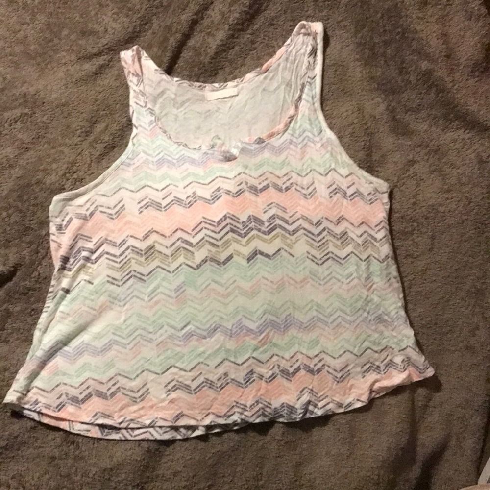 Pink and turquoise tank top with tiny buttons on the neckline